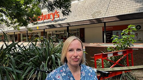 Cllr Claire Bonham outside Sainsbury's, next to the proposed development site.