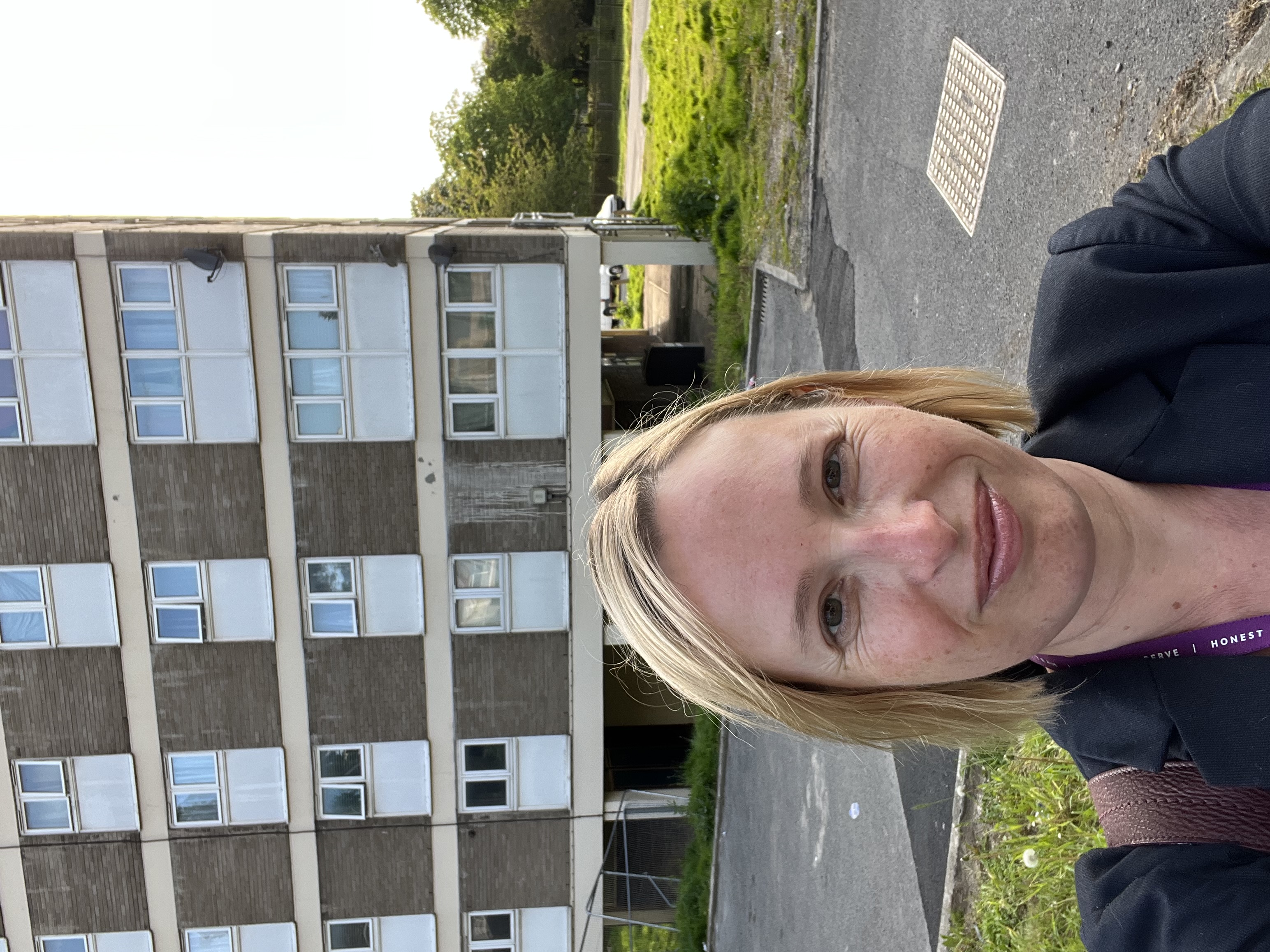 Claire standing outside Croydon council housing